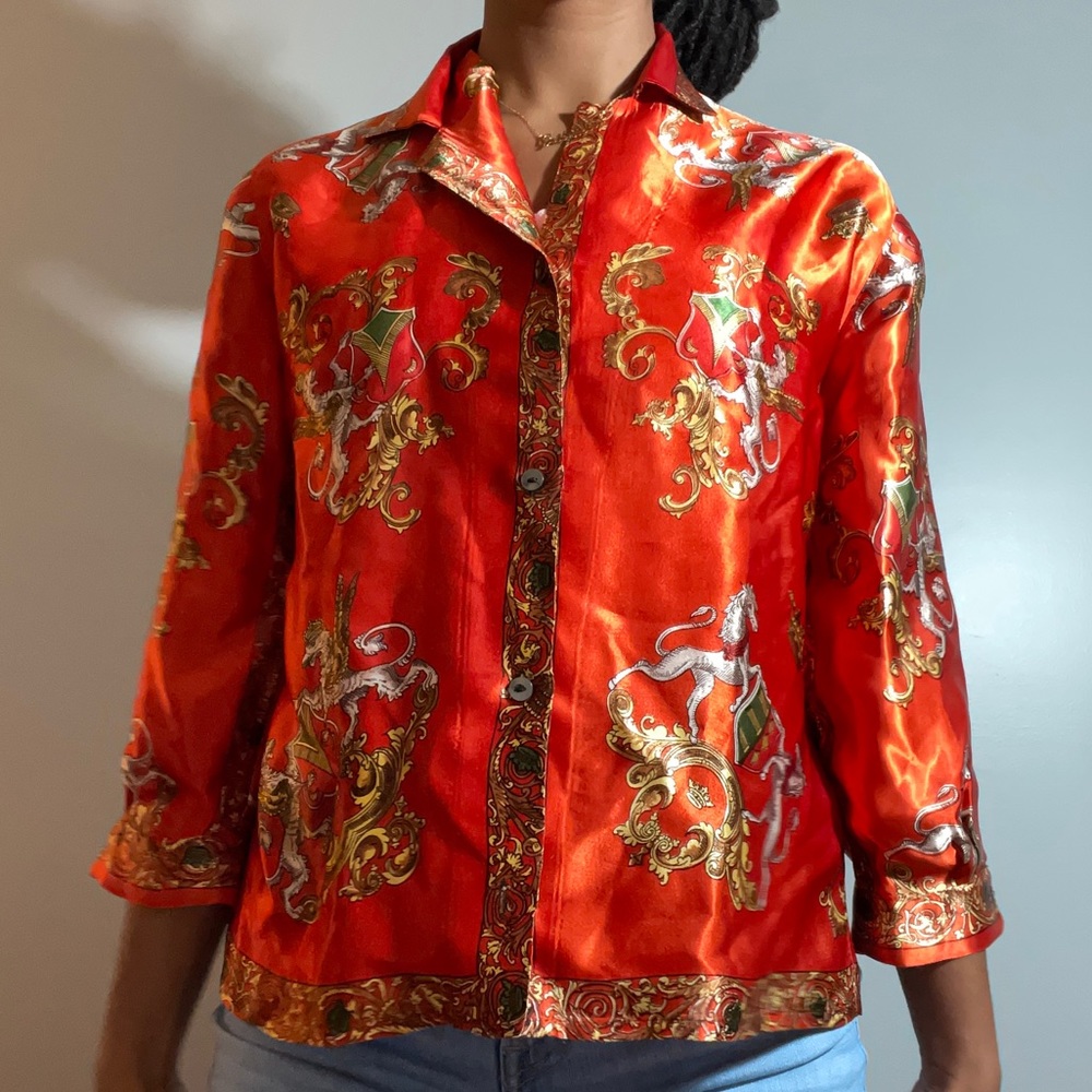 Red printed silk blouse.